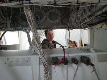 Carolyn attaching temperature sensors across the gondola from me